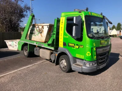 Throw and Tow skip Van dropping off a skip